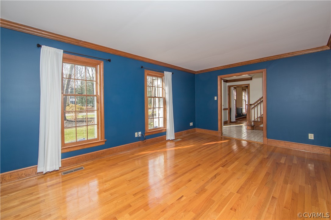 12905 Rivers Bend Road Chester, VA 23836 - Photo 8 of 27 The living room features gleaming wood floors and