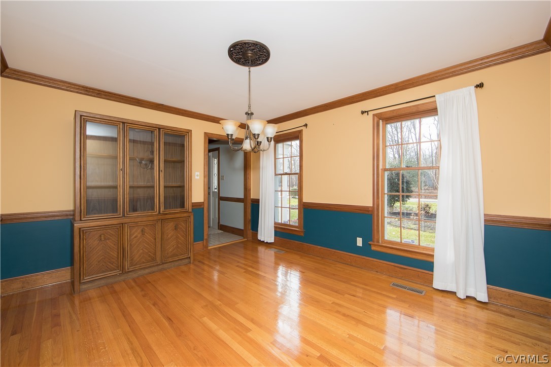 12905 Rivers Bend Road Chester, VA 23836 - Photo 9 of 27 The formal dining room also offers wood floors, al