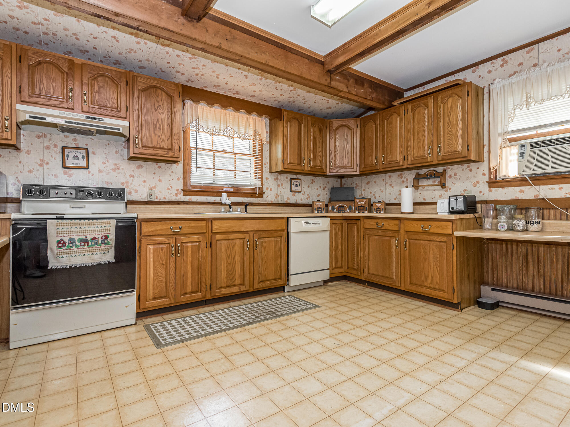 381 Royal Road Roseboro, NC 28382 - Photo 12 of 30 a kitchen with stainless steel appliances granite countertop a sink dishwasher stove top oven and cabinets