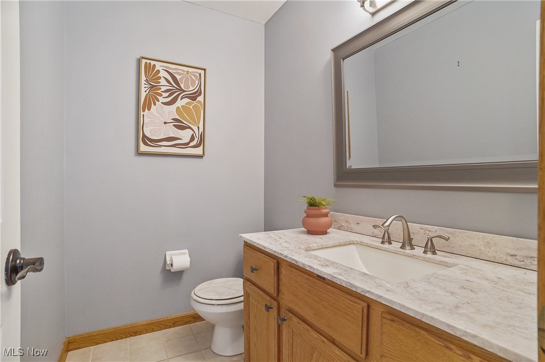 370 Wilcox Road Youngstown, OH 44515 - Photo 19 of 49 Half bathroom with vanity and tile patterned floors