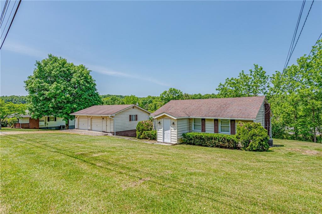 3018 Richey Road Connellsville, PA 15425 - Photo 1 of 27 a house with trees in the background