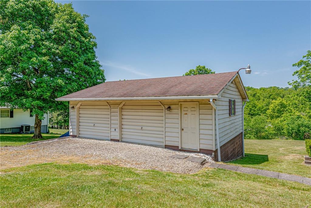 3018 Richey Road Connellsville, PA 15425 - Photo 2 of 27 a view of a house with a yard and garage