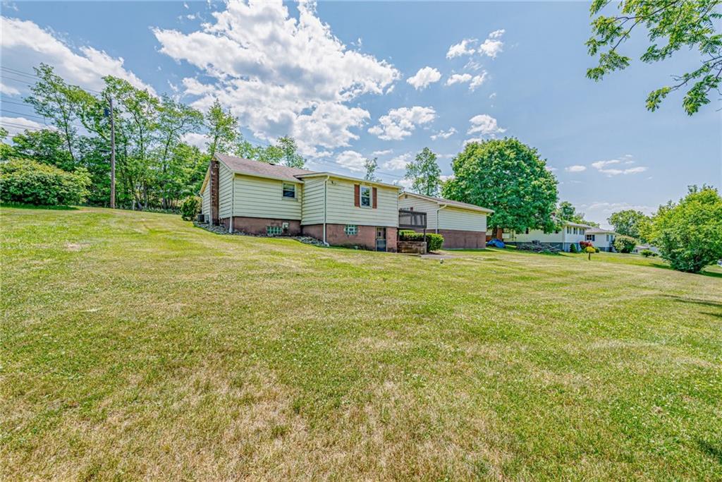 3018 Richey Road Connellsville, PA 15425 - Photo 24 of 27 a view of a house with a yard and garage