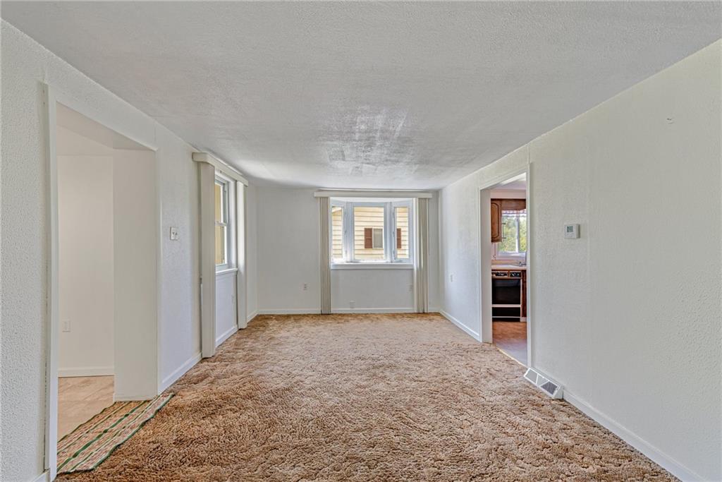 3018 Richey Road Connellsville, PA 15425 - Photo 6 of 27 an empty room with windows and closet