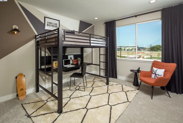 a living room with furniture a flat screen tv and floor to ceiling window