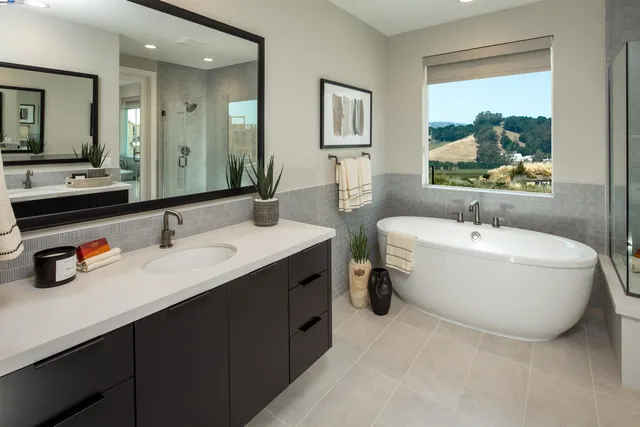 a bathroom with a double vanity sink mirror and double