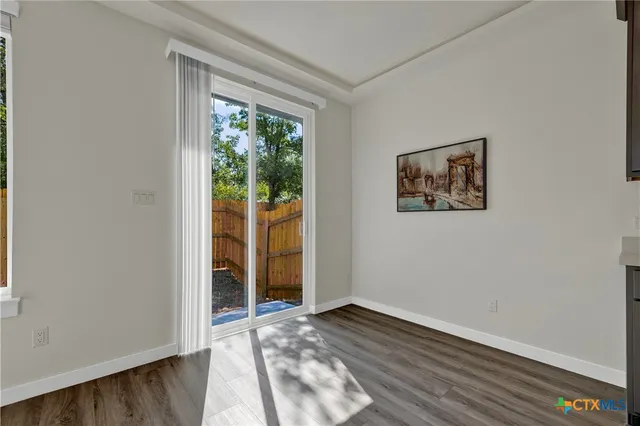 a workspace with furniture and wooden floor