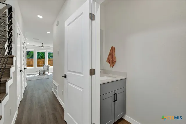 a bathroom with a sink a mirror and shower