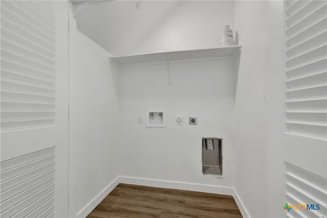 a living room with furniture and large windows