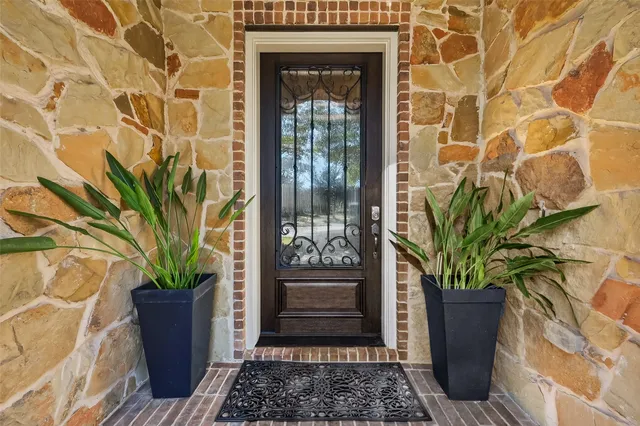 a view of entryway wih livingroom and stairs