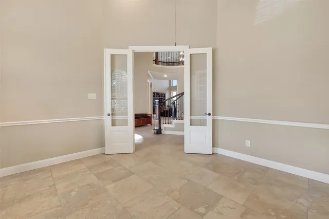 a kitchen with stainless steel appliances granite countertop wooden cabinets a stove a sink and a refrigerator