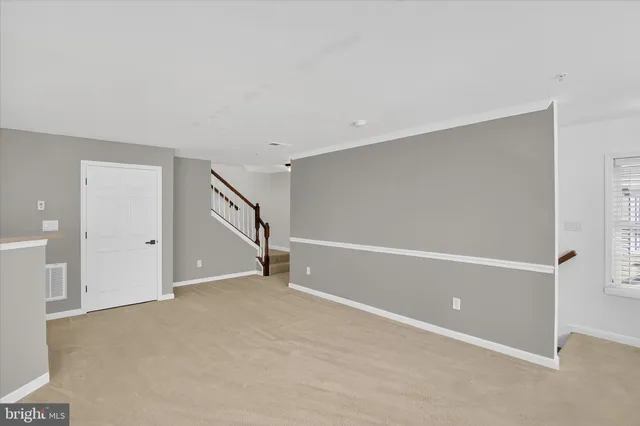 a view of kitchen with window and wooden floor