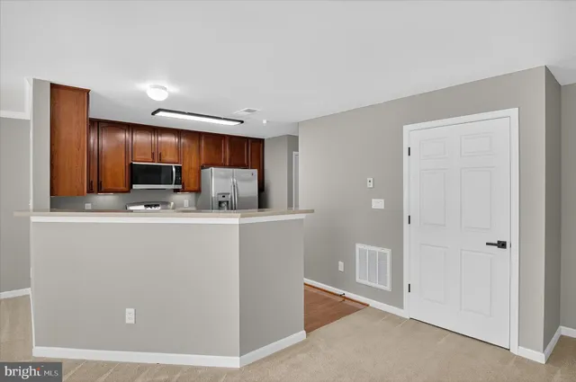 a view of an empty room with stairs