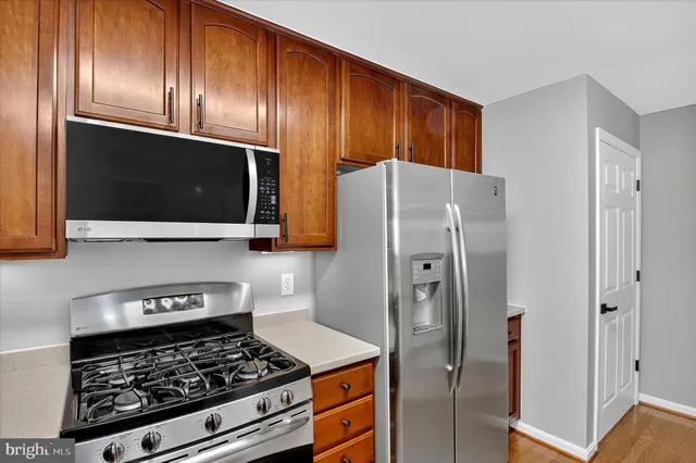 a kitchen with a refrigerator sink and microwave