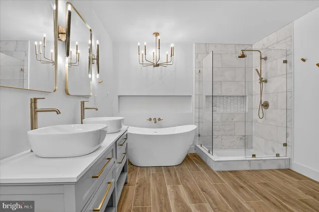 a hallway with wooden floor and closet