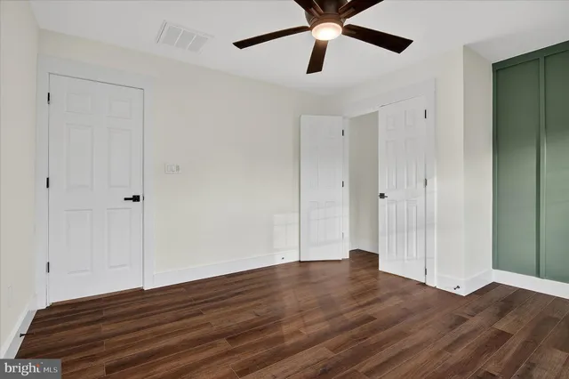 a bathroom with a toilet and shower