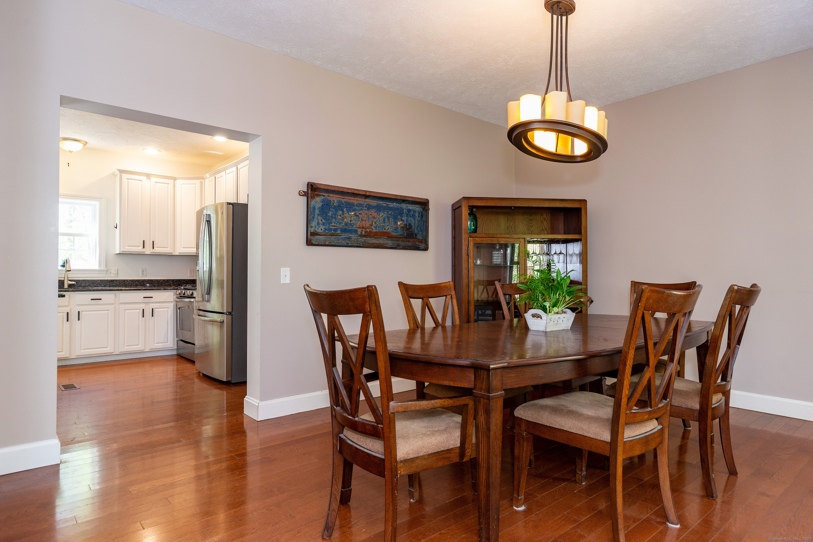127 Massapeag Road Montville, CT 06382 - Photo 16 of 39 a view of a dining room with furniture and wooden floor