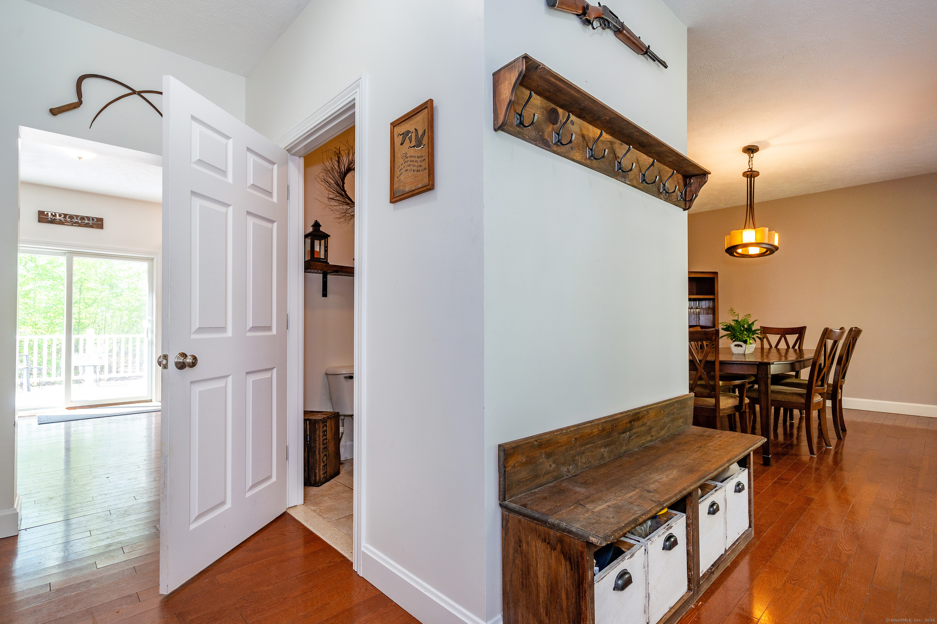 127 Massapeag Road Montville, CT 06382 - Photo 17 of 39 a room with furniture and wooden floor