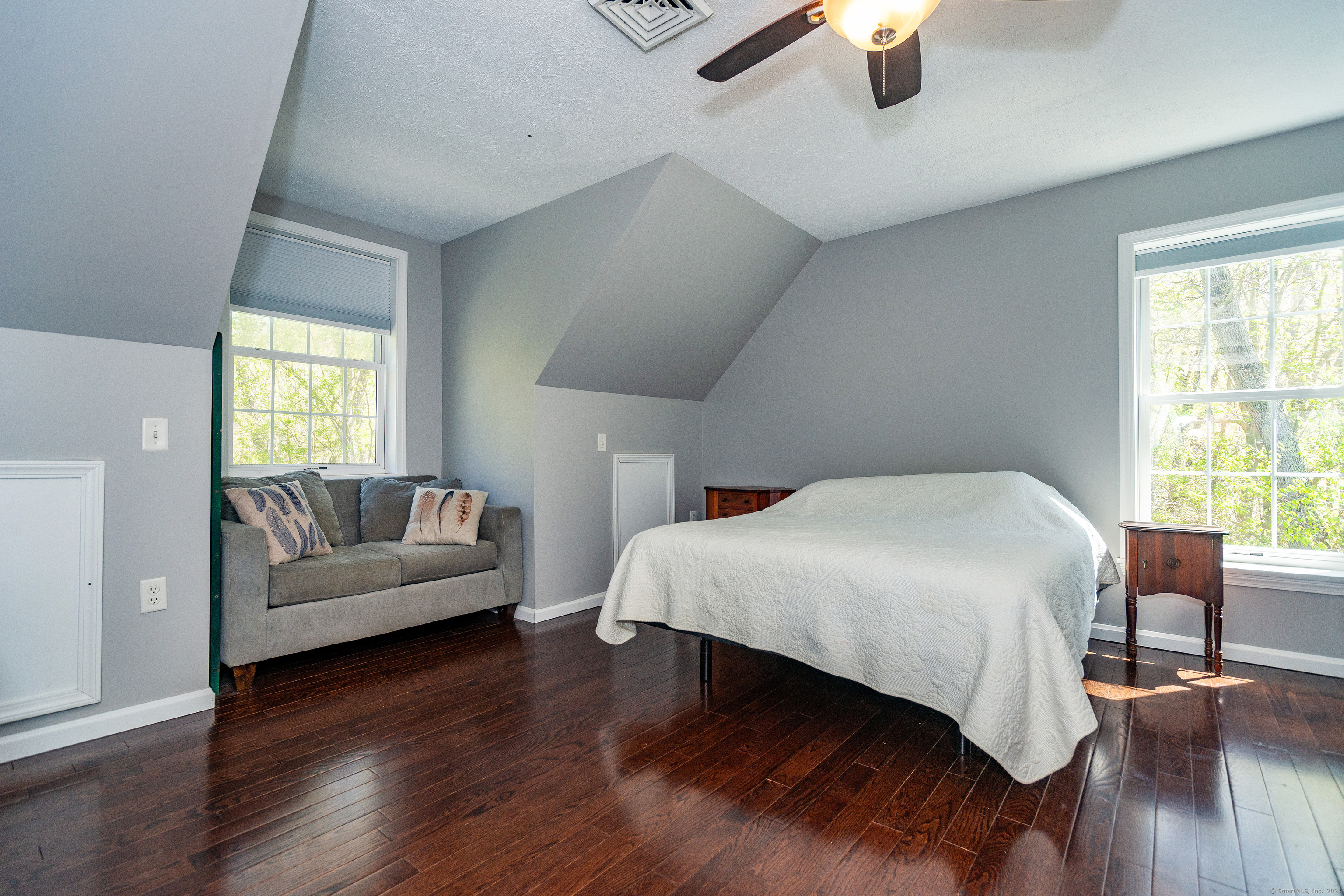 127 Massapeag Road Montville, CT 06382 - Photo 18 of 39 a bedroom with a bed and wooden floor