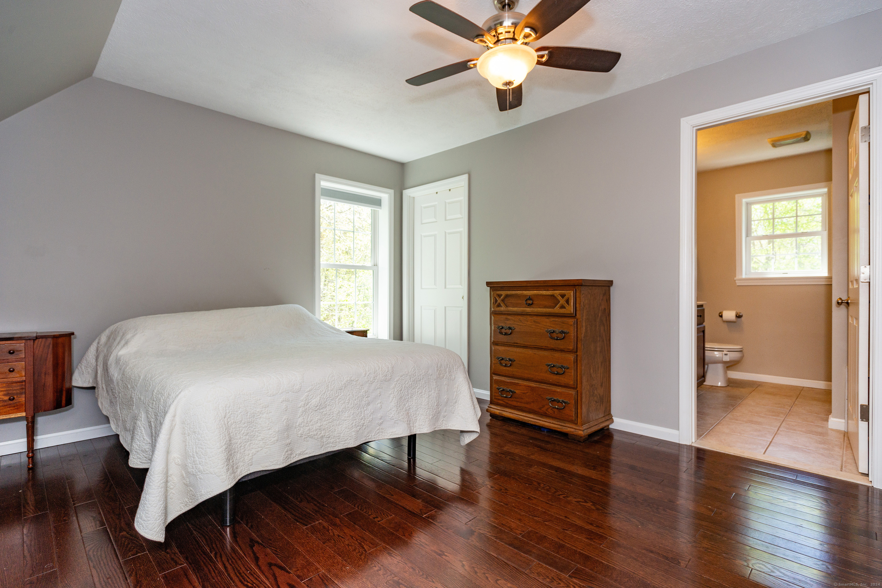 127 Massapeag Road Montville, CT 06382 - Photo 19 of 39 a bedroom with a bed and wooden floor