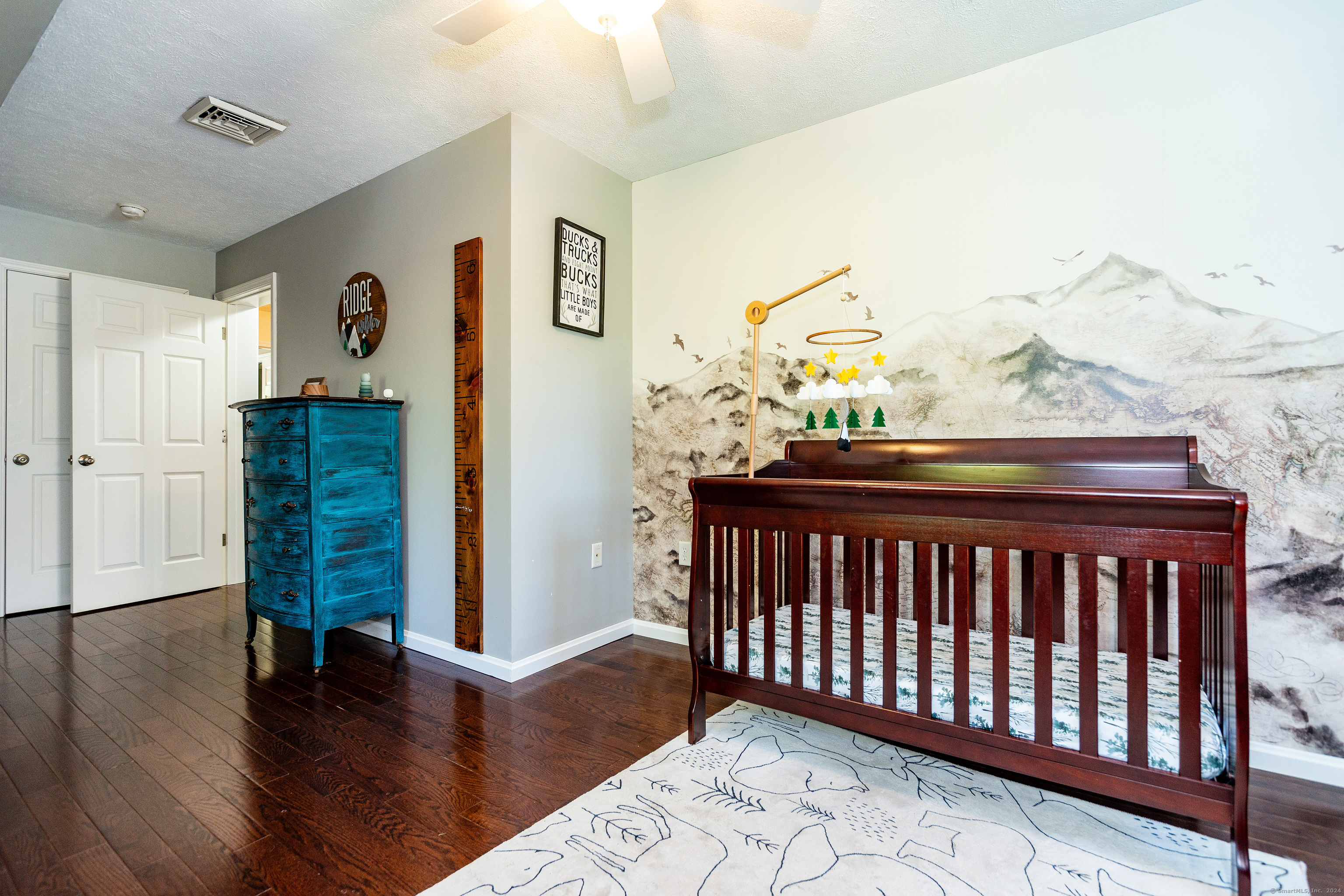 127 Massapeag Road Montville, CT 06382 - Photo 22 of 39 a bedroom with furniture and wooden floor