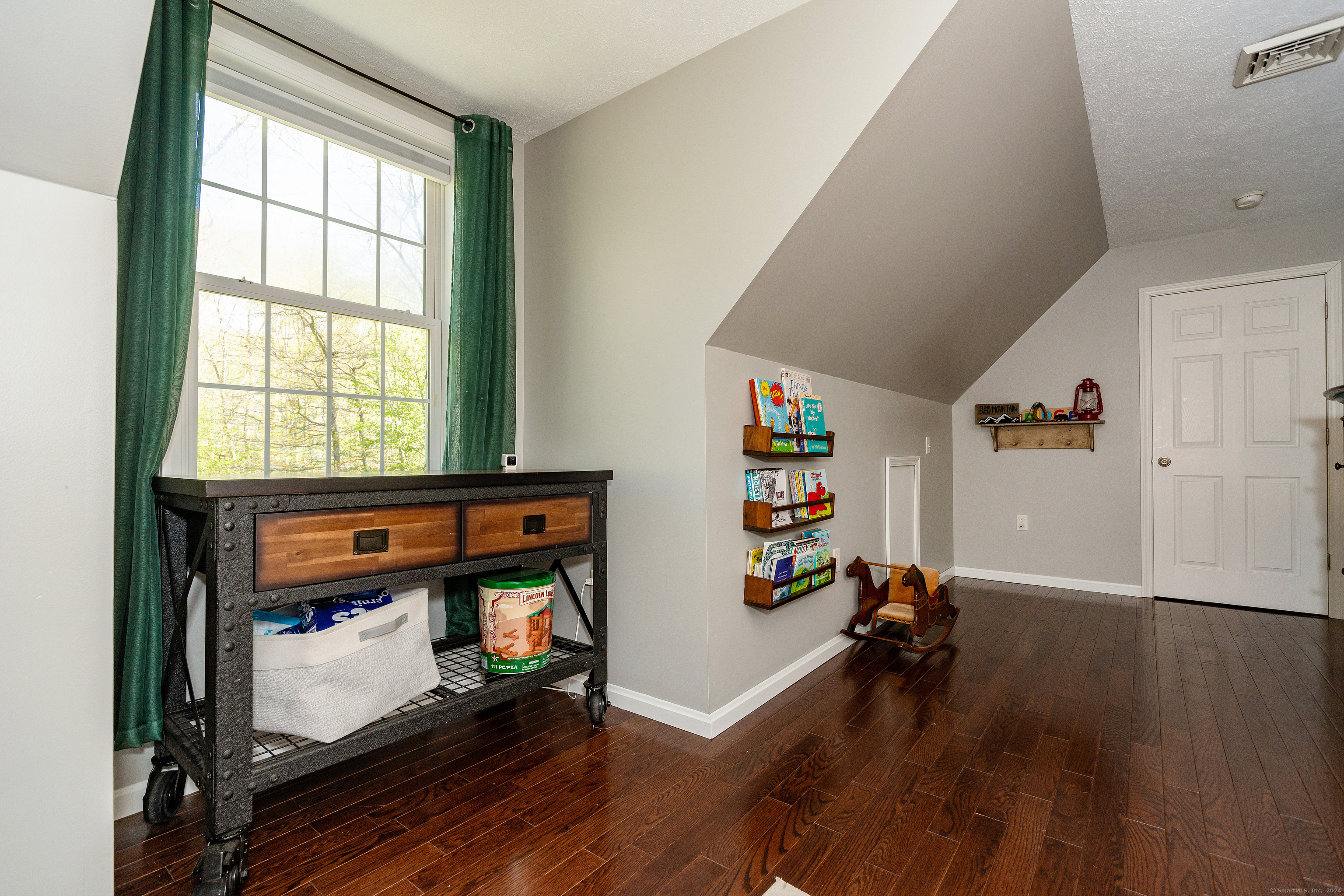 127 Massapeag Road Montville, CT 06382 - Photo 23 of 39 a living room with furniture and a fireplace