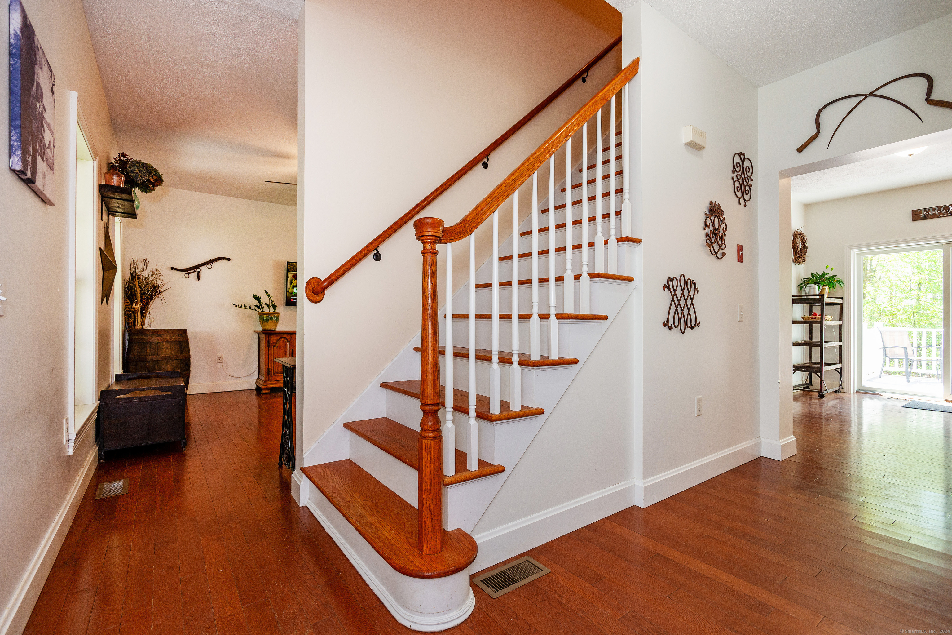127 Massapeag Road Montville, CT 06382 - Photo 8 of 39 a view of entryway with wooden floor and stairs