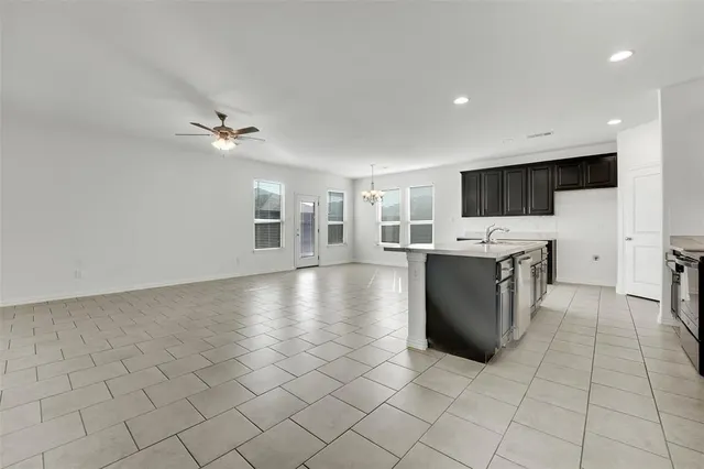 a bathroom with a tub sink shower and mirror