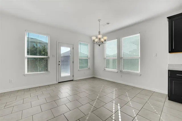 a view of a livingroom with a kitchen counter tops and a fireplace