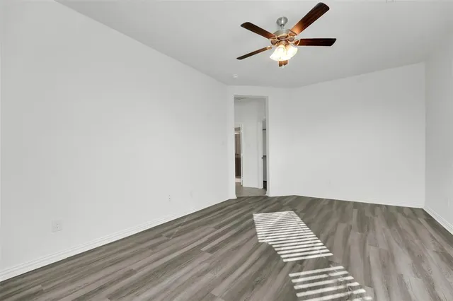 a view of kitchen with granite countertop lots of counter top space