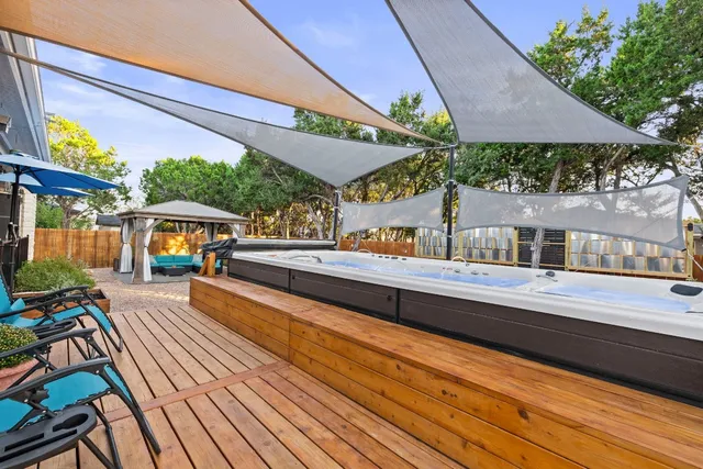 a view of backyard with seating space and trees