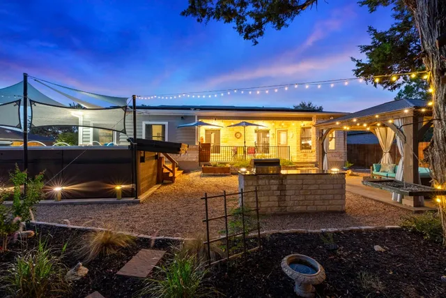 a kitchen with stainless steel appliances a sink stove and refrigerator