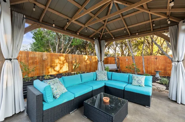 a view of backyard with seating space