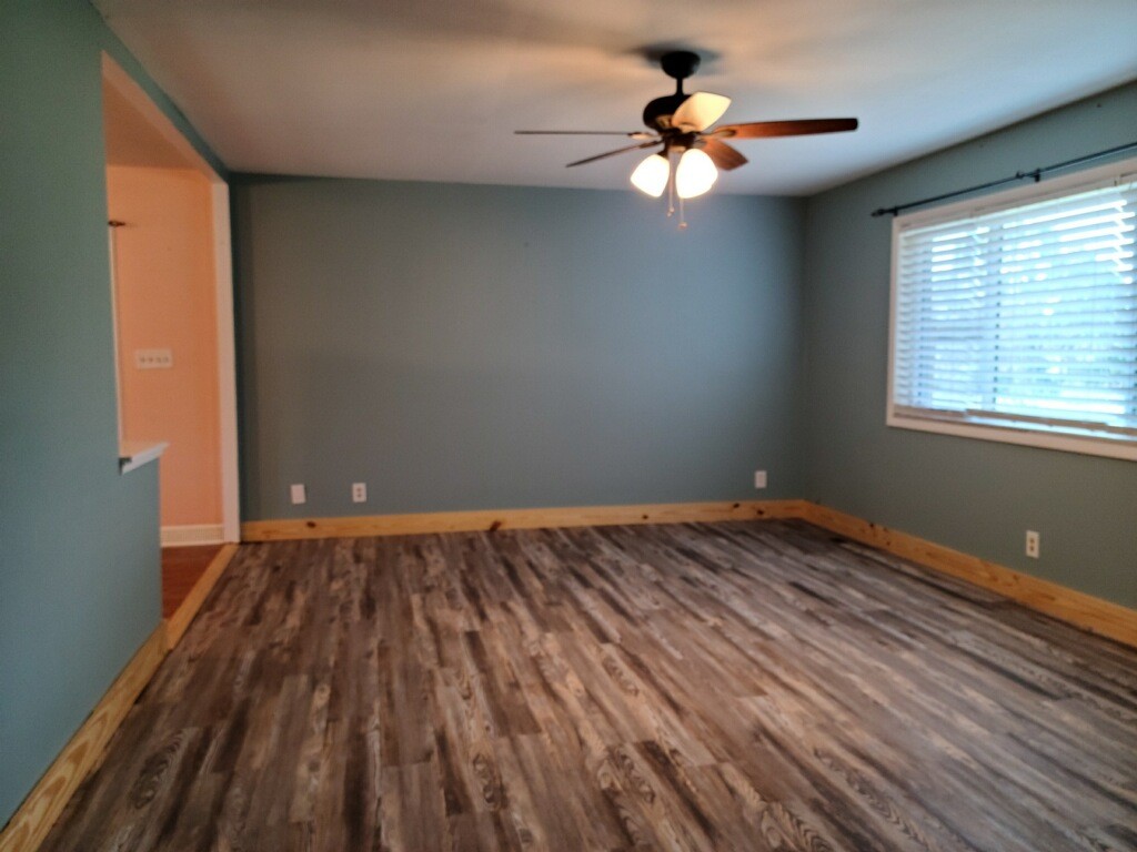 26 Morris Road Leoma, TN 38468 - Photo 2 of 13 a view of an empty room with window and wooden floor