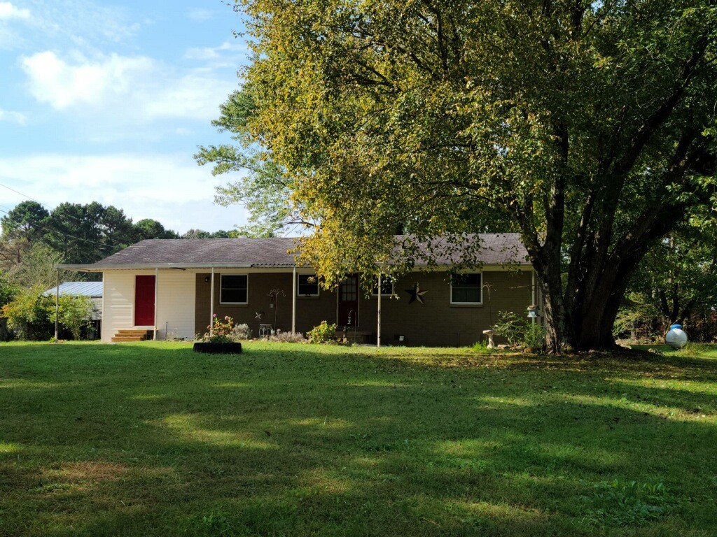 26 Morris Road Leoma, TN 38468 - Photo 5 of 13 a front view of a house with a yard and trees