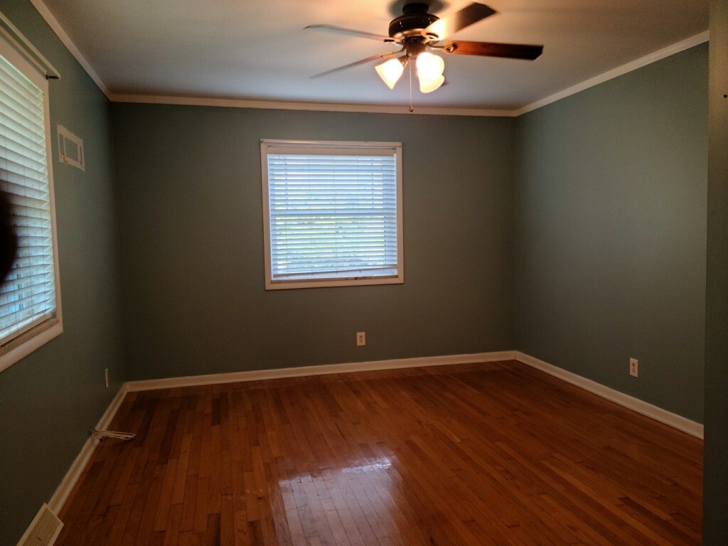 26 Morris Road Leoma, TN 38468 - Photo 10 of 13 a view of an empty room with wooden floor and a window