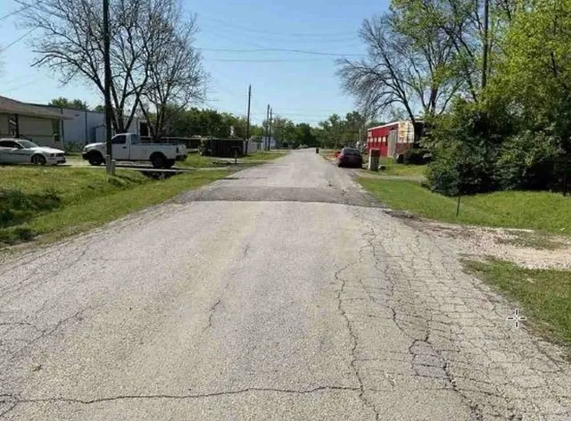 a view of park with bench and trees