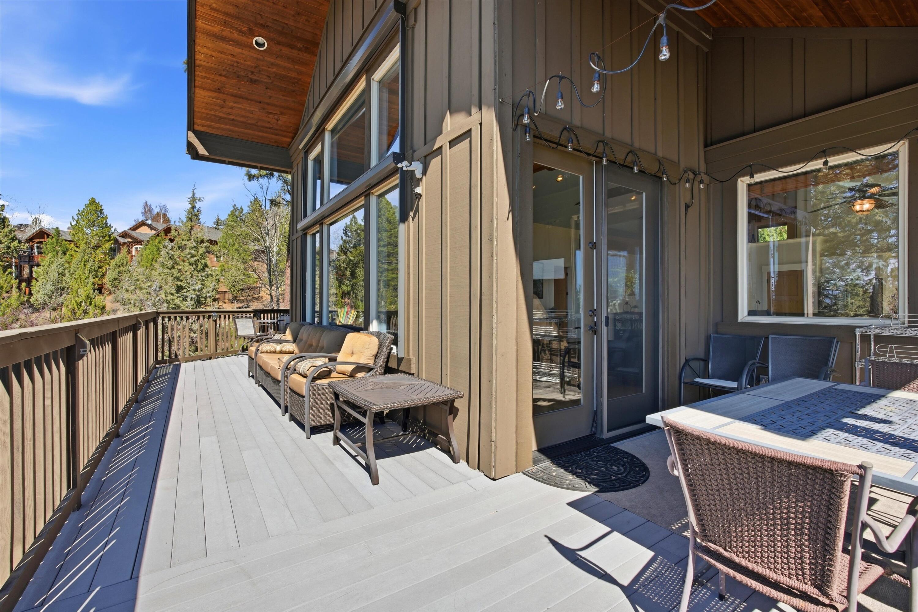 15 Southwest Quail Butte Place Bend, OR 97703 - Photo 50 of 55 a balcony with furniture and a potted plant