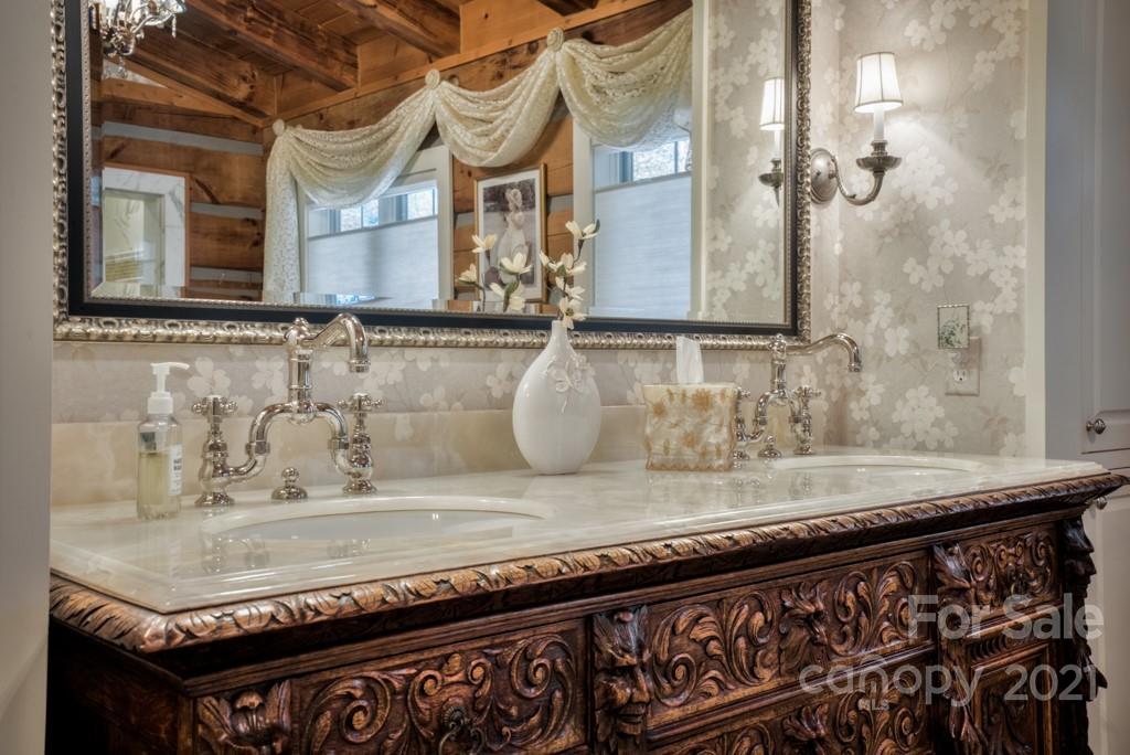 4735 Hunting Country Road Tryon, NC 28782 - Photo 22 of 46 a bathroom with a granite countertop sink and a mirror