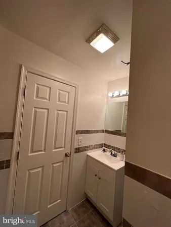 a view of a bathroom with a sink and a mirror