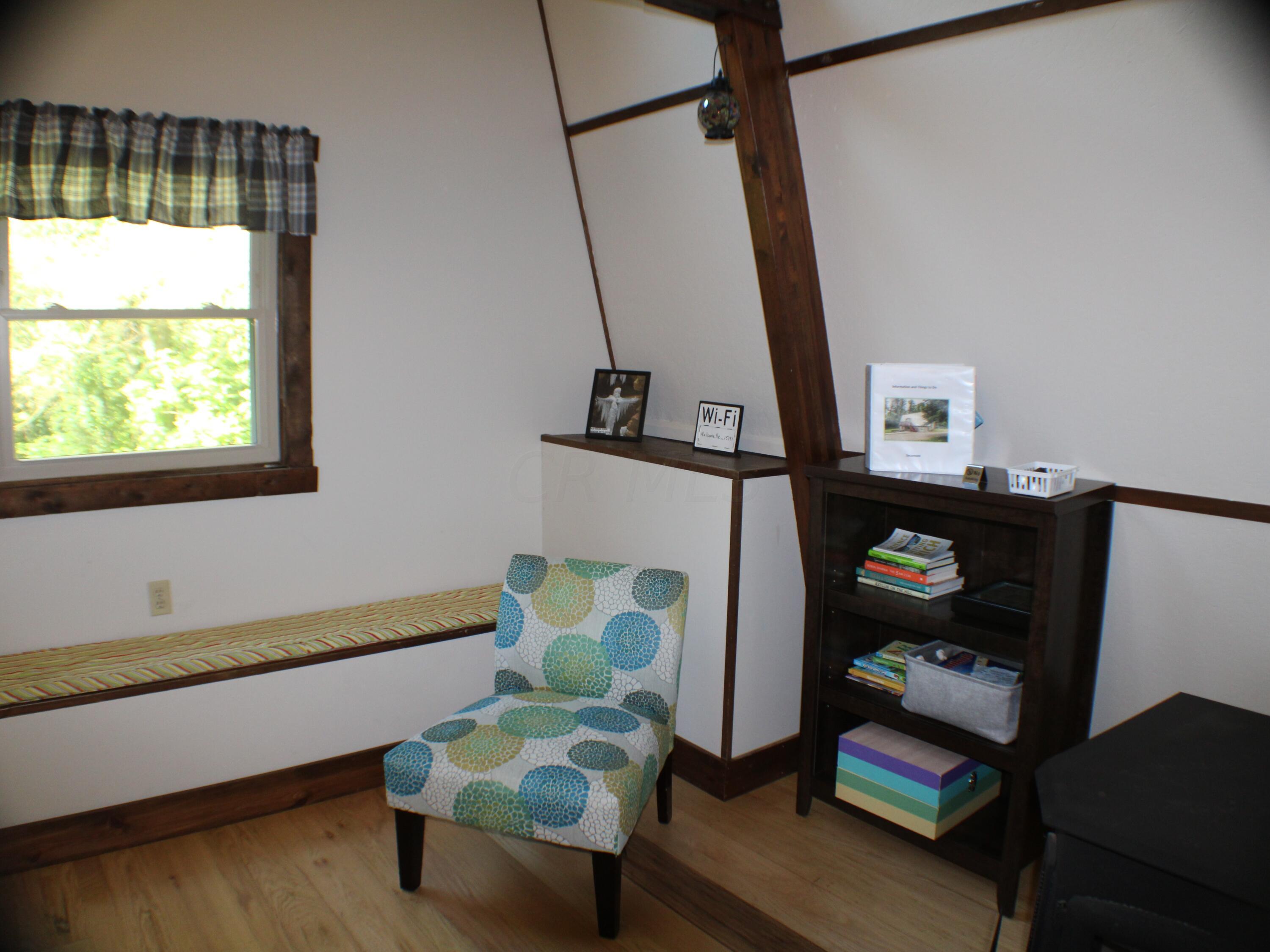 15191 Wollet Road Nelsonville, OH 45764 - Photo 5 of 27 Chair and Bookshelf in LR