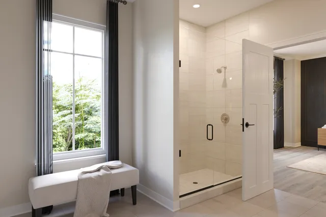 a bathroom with a granite countertop sink a mirror and next to a window