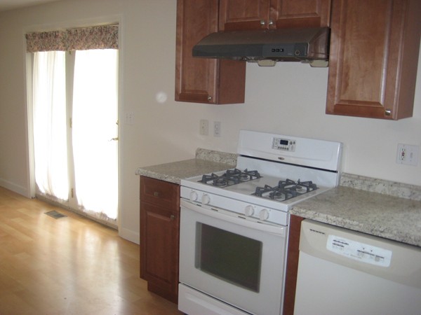 23 Stonegate Road Chelmsford, MA 01824 - Photo 5 of 15 a stove top oven sitting inside of a kitchen