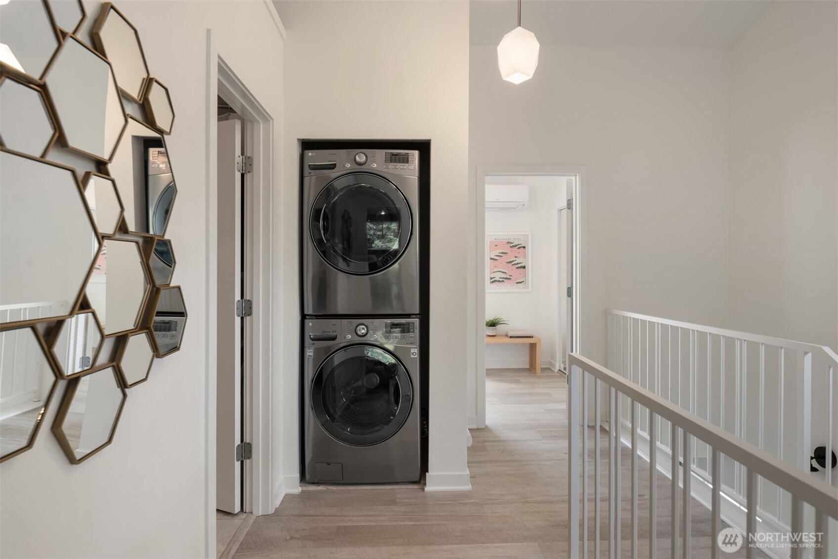 3302 West Government Way, Unit A Seattle, WA 98199 - Photo 22 of 32 a view of a hallway with washer and dryer