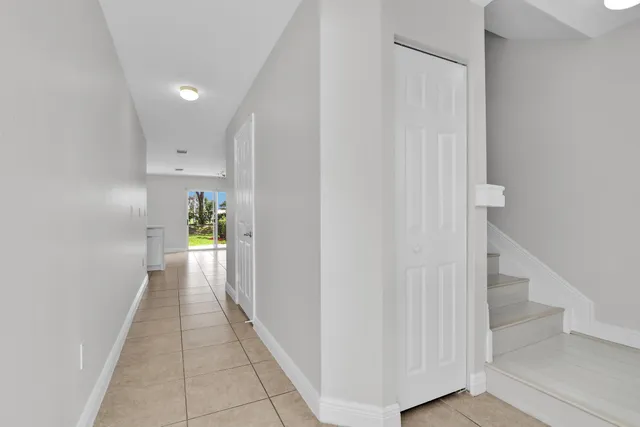 a view of a hallway view with staircase