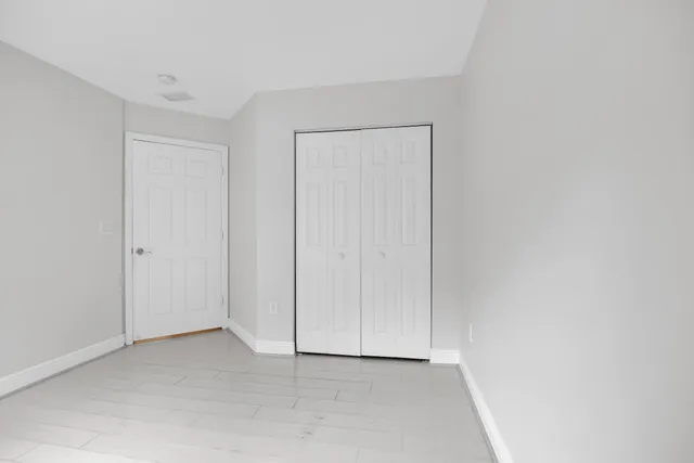 a bathroom with a bathtub shower sink vanity and toilet