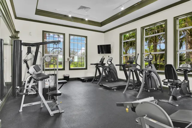 a front view of a house with swimming pool having outdoor seating