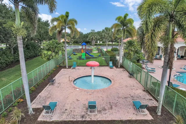 an aerial view of residential houses with outdoor space and garden