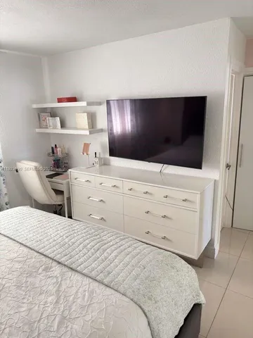 a bedroom with a bed and a cabinets