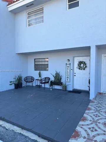 a living room with furniture and window